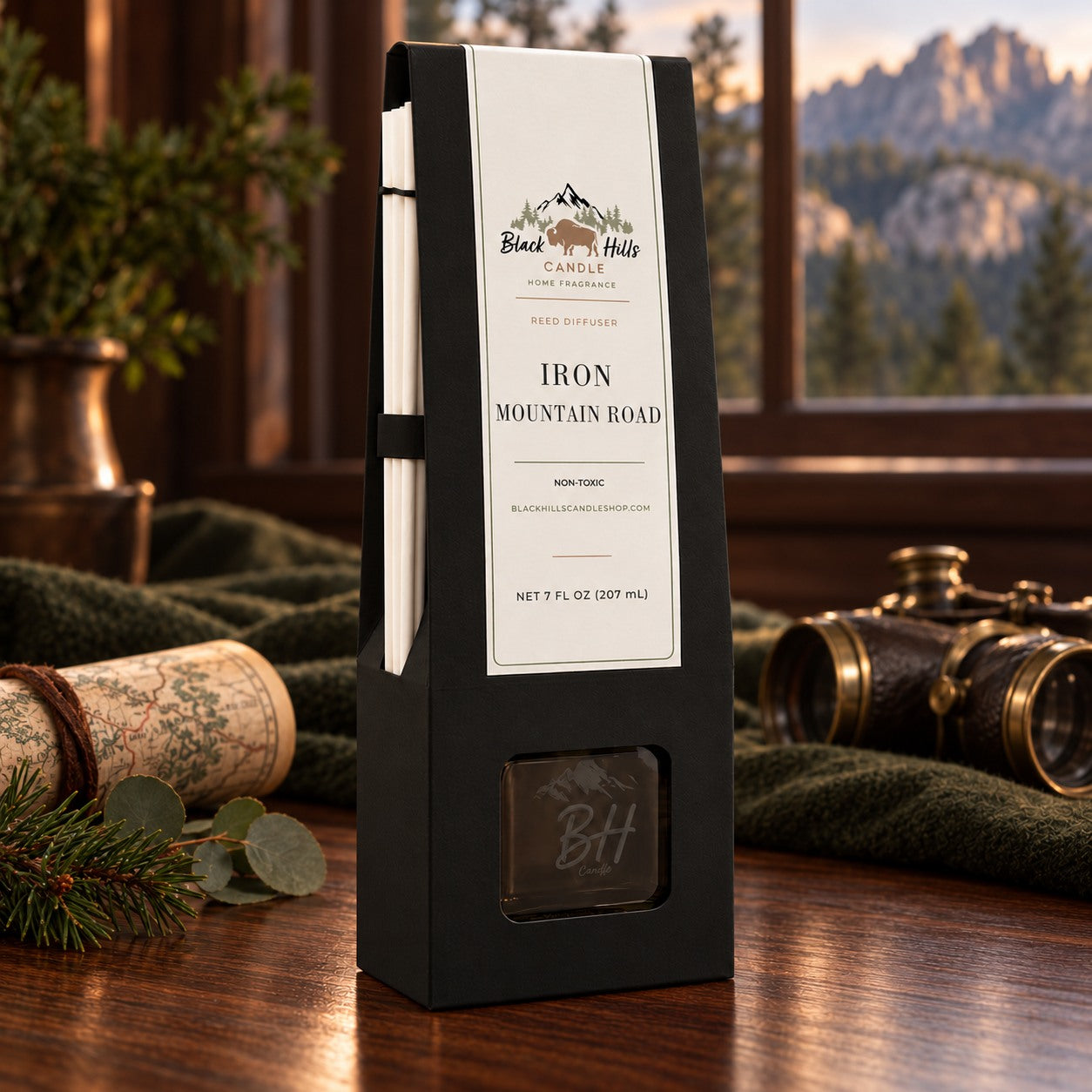 Iron Mountain Road reed diffuser in black gift packaging in a dark country-chic setting
