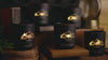 Five black candles flickering on a table. Needles, Highways, Sylvan Lake, Campfire, Cowboy Gulch